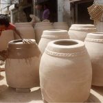 An artisan is busy in preparing a traditional oven “Tandoor” at his workplace