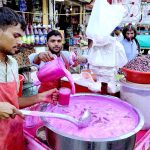 Vendors selling traditional summer drink at Pakistan Chowk during scorching hot weather in the city