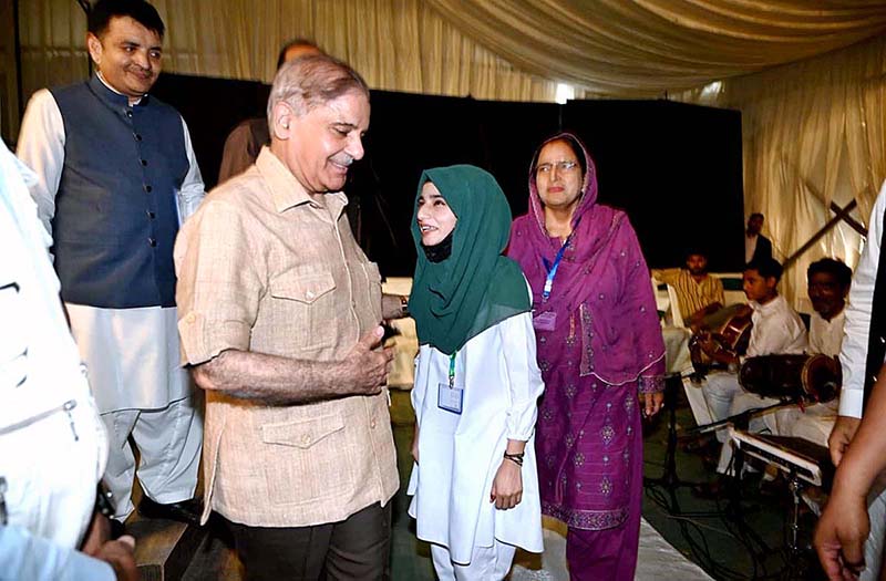 Prime Minister Muhammad Shehbaz Shareef interacts with students and children during his visit at Sabzazar Sports Complex