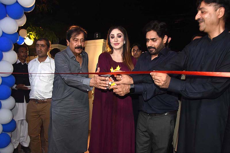 Chairperson Almarah Foundation Mrs. Sofia Warriach, Pakistani Singer Abrar ul Haq and Dy. Inspector General of police Mehboob Lilla cutting ribbon during the completion of 100 kids and inauguration the 5th house of Almarah Foundation