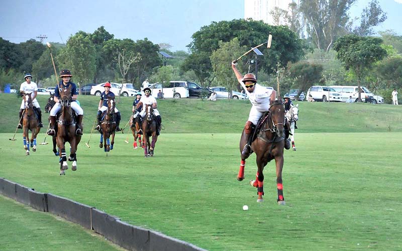 Players struggling to get control on the ball during final of Junior Polo Exhibition Match played between Islamabad Club Junior and Dubai Polo and Equestrian Club Junior teams at Islamabad Club Polo Ground