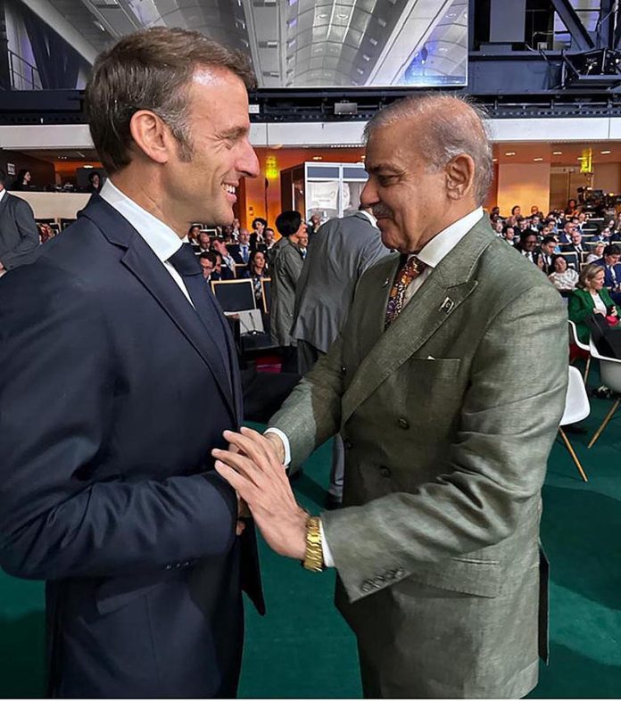 Prime Minister Muhammad Shehbaz Sharif meets President of France Emmanuel Macron on the sidelines of New Global Financial Pact Summit being held in France