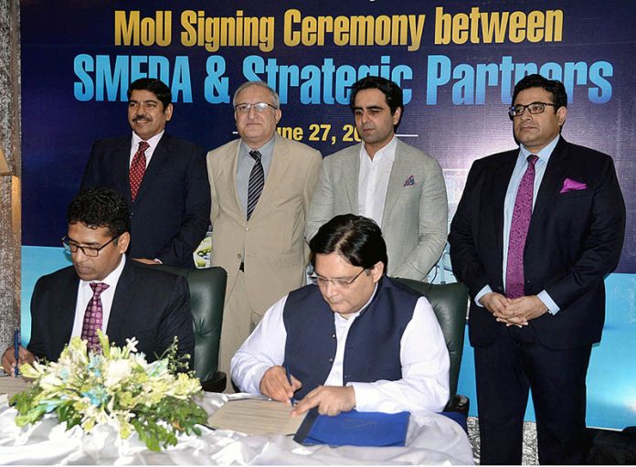 Federal Minister of Industries & Production Syed Murtaza Mehmood witnessing the signing ceremony of MoU between SMEDA & Strategic Partners