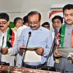 Commissioner, Ghanwar Ali Laghari administering oath to newly Elected Mayor of Municipal Corporation, Adv Anwar Ali Luhur and Deputy Mayor Muhammad Amin Shaikh at Begum Nusrat Bhutto Auditorium Jinnah Bagh