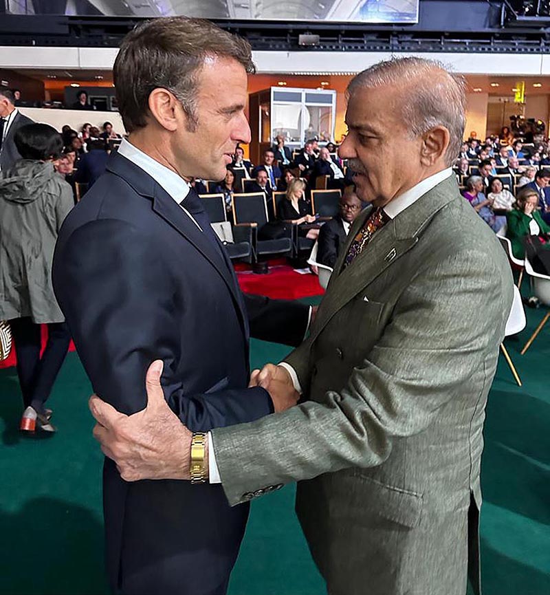 Prime Minister Muhammad Shehbaz Sharif meets President of France Emmanuel Macron on the sidelines of New Global Financial Pact Summit being held in France