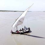 People of Katcha area crossing Indus River through boat near Aqil Village