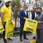 Deputy Commissioner Malik Adnan Mahmood Awan distributing plastic bags by Sialkot Waste Management Company to public for disposal of the offal of sacrificial animals on Eidul Azha