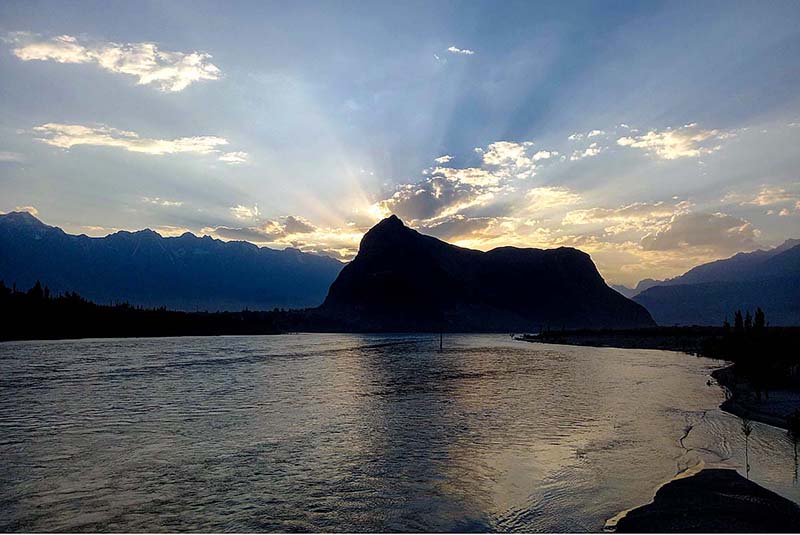 An attractive and eye catching view of sunrays peeping through clouds