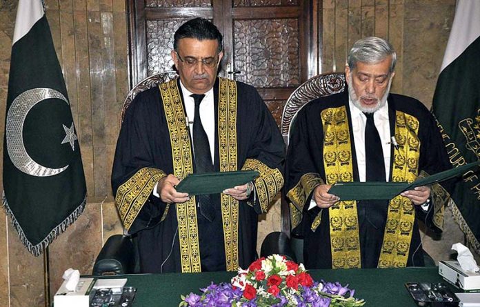 Honourable Mr. Justice Umar Ata Bandial, Chief Justice of Pakistan administering the oath of office to Honourable Mr. Justice Iqbal Hameed-ur-Rehman, former Judge of the Supreme Court of Pakistan, as Chief Justice of the Federal Shariat Court at Supreme Court of Pakistan