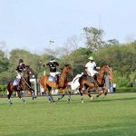 Players struggling to get control on the ball during a Juinor Polo Exhibition Match between Islamabad Club Junior Team and Dubai Polo and Equestrian Club Junior Team