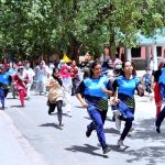 Students participating in a marathon race during summer camp at Women's University