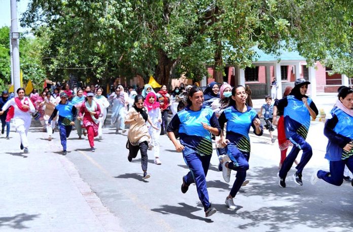 Students participating in a marathon race during summer camp at Women's University