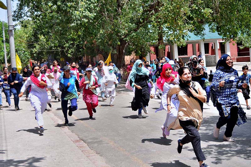 Students participating in a marathon race during summer camp at Women's University