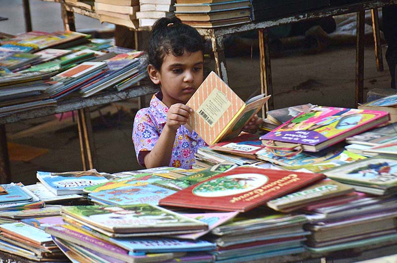 People busy in selecting and purchasing old books from roadside setup in Provincial Capital