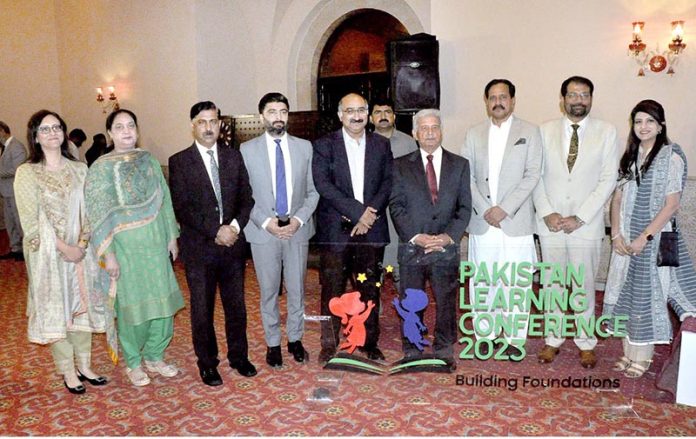 Federal Minister for Education and Professional Training, Rana Tanveer Hussain in a group photo during the Pakistan Learning Conference organised by the Federal Ministry of FE&PT