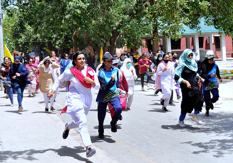 Students participating in a marathon race during summer camp at Women's University