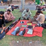 A street vendor displaying used Laptops to attract the customers at his roadside setup in Provincial Capital