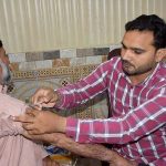Staffer of the Health Department is giving Meningitis, Polio Vaccine and Covid-19 Boots to the pilgrims at Hajj Camp of Ministry of Hajj