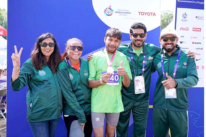 Gold Medalist in 100m Race Muhammad Luqman on victory stand during the Special World Games Athletics
