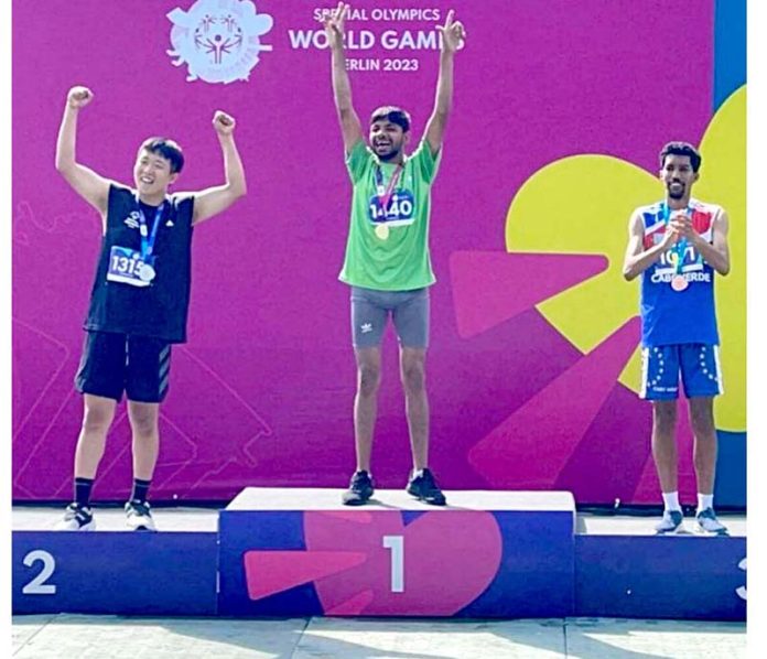 Gold Medalist in 100m Race Muhammad Luqman on victory stand during the Special World Games Athletics