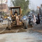 Labourers are busy in construction and development work of flyover to reduce the traffic problems at Feroz Pur Road