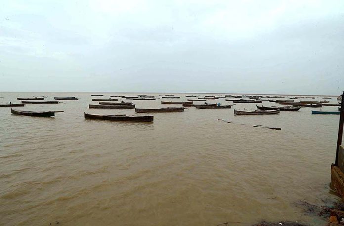 A view of large number of boats parked at zero point before cyclone Biparjoy approaches the coast area