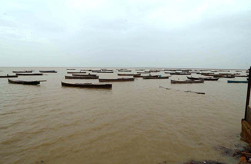 A view of large number of boats parked at zero point before cyclone Biparjoy approaches the coast area