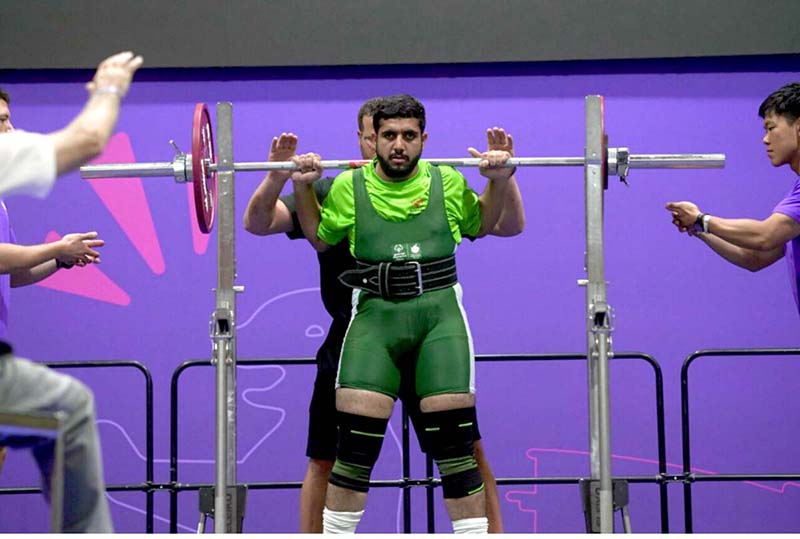 Gold Medalist in 100m Race Muhammad Luqman on victory stand during the Special World Games Athletics