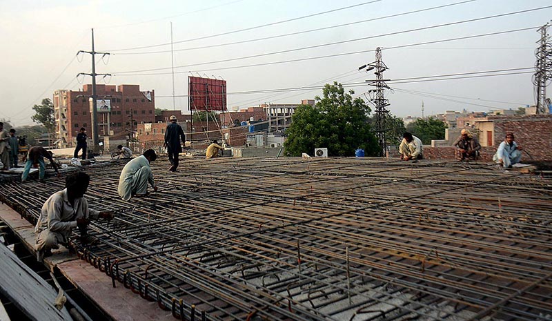 Labourers are busy in construction and development work of flyover to reduce the traffic problems at Feroz Pur Road