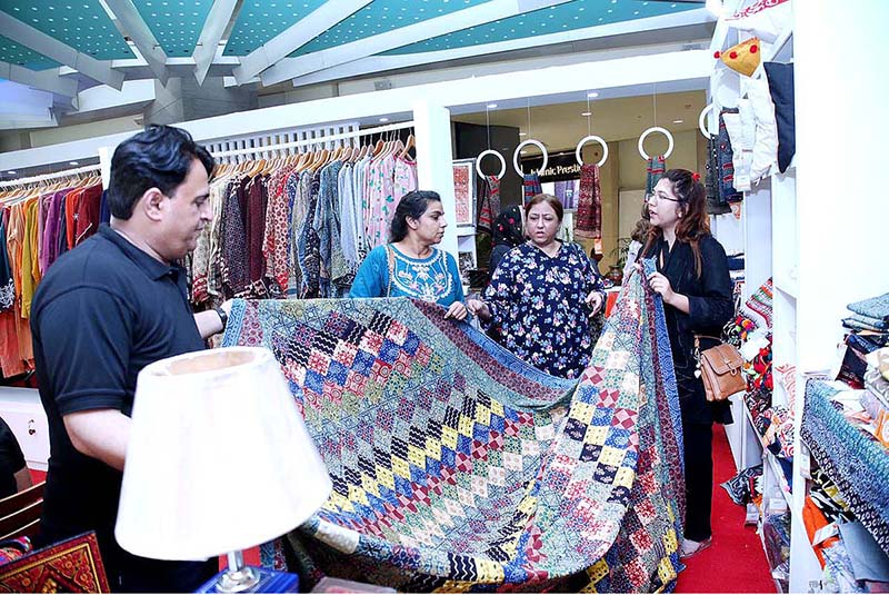 Visitors showing their keen interest in handicrafts during 13th Sartyoon Sang Crafts Exhibition organized by the Sindh Rural Support Organization (SRSO) in collaboration with the Sindh Government to facilitate better incomes for the women artisans of rural Sindh