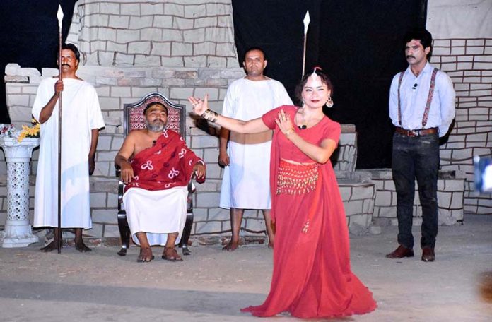 Artists performing in stage drama 