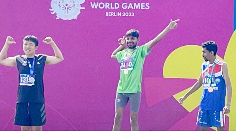 Gold Medalist in 100m Race Muhammad Luqman on victory stand during the Special World Games Athletics