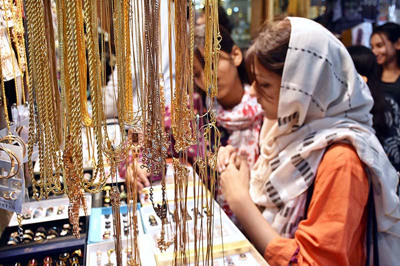 Girls selecting artificial jewelry for preparation of upcoming Eidul Azha at Reshamgali
