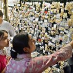 Girls selecting artificial jewelry for preparation of upcoming Eidul Azha at Reshamgali