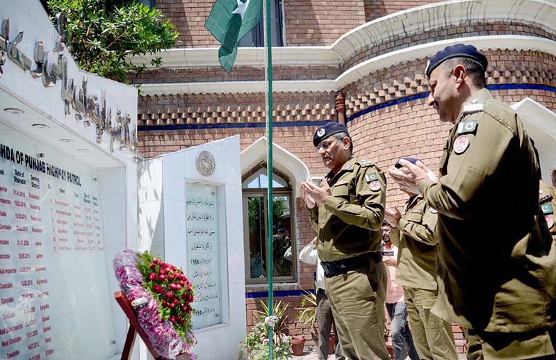 Additional IG Punjab Highway Patrol Rao Abdul Kareem offering dua after laying floral garland on the monument of Shuhda of Punjab Highway Patrol during his visit to Regional PHP Office Faisalabad