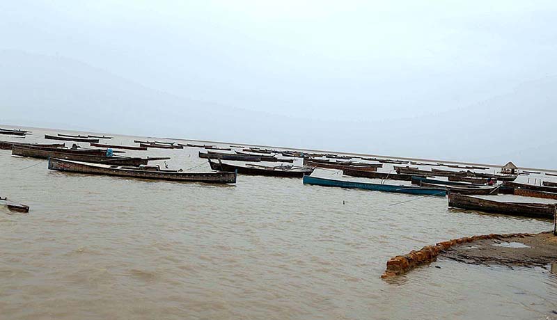 A view of large number of boats parked at zero point before cyclone Biparjoy approaches the coast area