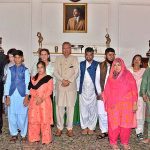 President Dr. Arif Alvi and Begum Samina Arif Alvi posing for a group photo with delegation of Association of Retarded Children Karachi and special children at Governor House