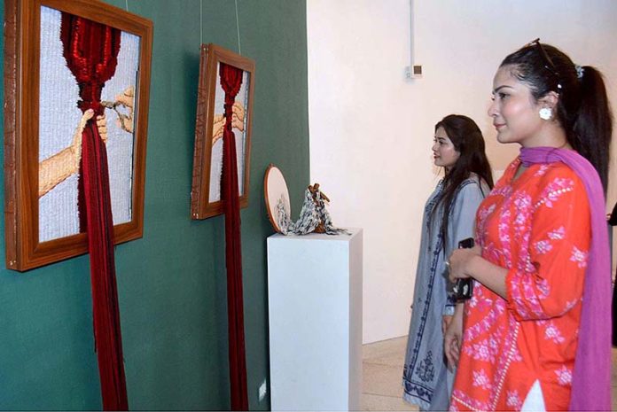 Students of Kinnaird College for Women taking keen interest in Textile Exhibition at Al-Hamra Art Gallery