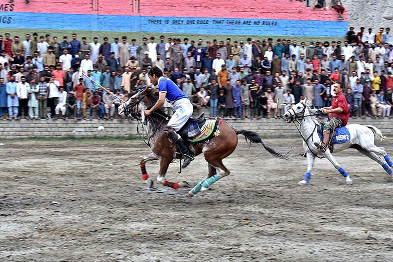 Players in action during the 1st final of Jashn-e-Baharan Freestyle Polo Tournament at Agha Khan Shahi Polo Ground
