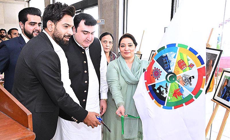 Deputy Speaker National Assembly Zahid Akram Durrani and Convener SDGs Task Force Ms. Romina Khursheed with SDGs Good Will Ambassador Famous Cricketer Haris Rauf inaugurating the pictorial exhibition of SDGs at Parliament House