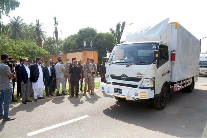 Governor Sindh Kamran Khan Tessori seen during Trucks carrying 20000 ration bags arrive at Governor House biggest ever ration drive under Taqatwar Pakistan programme