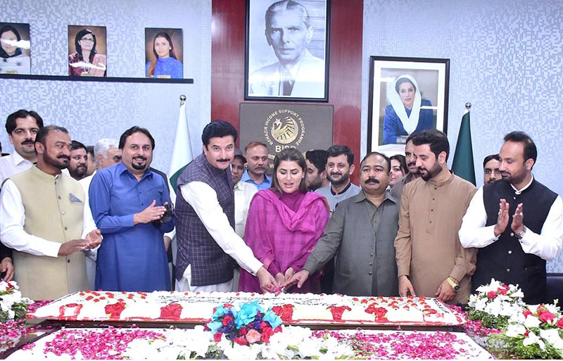 Federal Minister and Chairperson Benazir Income Support Programme Ms. Shazia Marri and Minister of State Faisal Karim Kundi cutting cake on 70th birth anniversary of Shaheed Mohtarma Benazir Bhutto at BISP Headquarters. Parliamentary Secretary Naveed Aamer Jeeva also present on the occasion