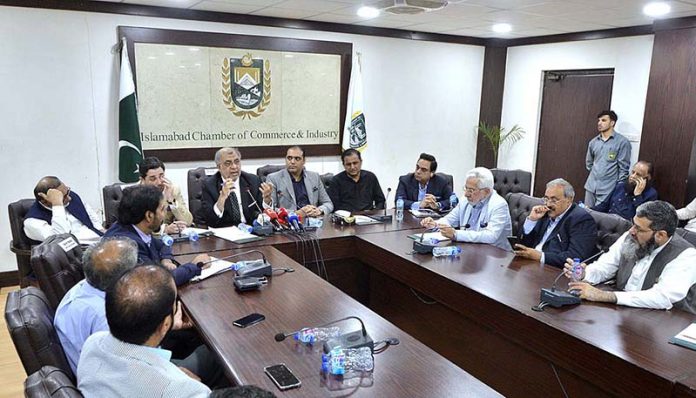 Minister of State and Chairman Reforms and Reduces Mobilization Committee Ashfaq Yousuf Tola addressing to the post budget session at Islamabad Chamber of Commerce & Industry