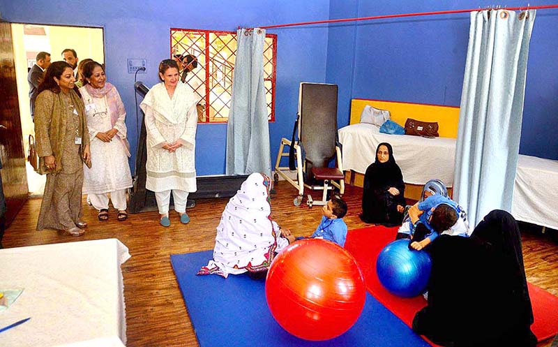 Begum Samina Arif Alvi visiting the society for the Rehabilitation of Special Children Centre