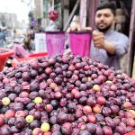 A vendor selling traditional summer drink at Pakistan Chowk during hot weather in the city