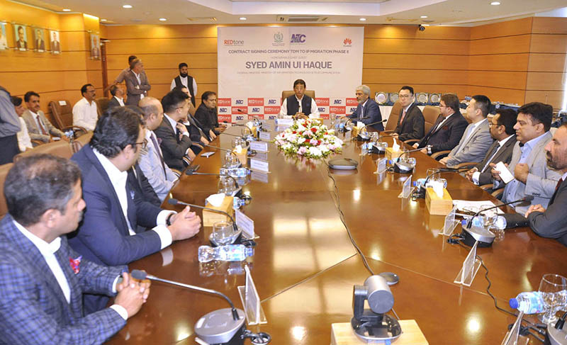 Federal Minister for IT and Telecommunication Syed Amin Ul Haque chairing a meeting during the 'MoU Signing Ceremony of TDM to IP and Copper Wire to Optical Fiber Cable Migration of NTC Exchanges Phase 2' at National Telecommunication Corporation (NTC) Headquarters
