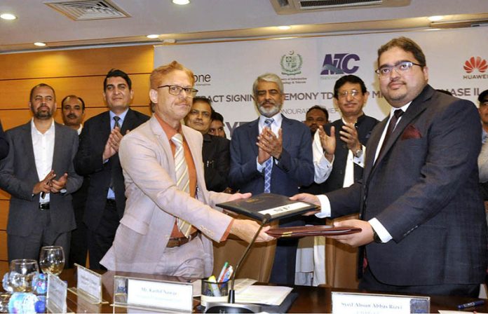 Federal Minister for IT and Telecommunication Syed Amin Ul Haque witnessing the 'MoU Signing Ceremony of TDM to IP and Copper Wire to Optical Fiber Cable Migration of NTC Exchanges Phase 2' at National Telecommunication Corporation (NTC) Headquarters