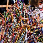 A vendor displaying the stationary items (colorful pencils) to attract the customers outside the Dehli Gate