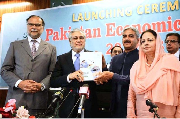 Dr. Imtiaz Ahmad, Economic Adviser, Finance Division presented copy of Pakistan Economic Survey 2022-23 to Finance Minister Senator Mohammad Ishaq Dar at the launching ceremony of Pakistan Economic Survey