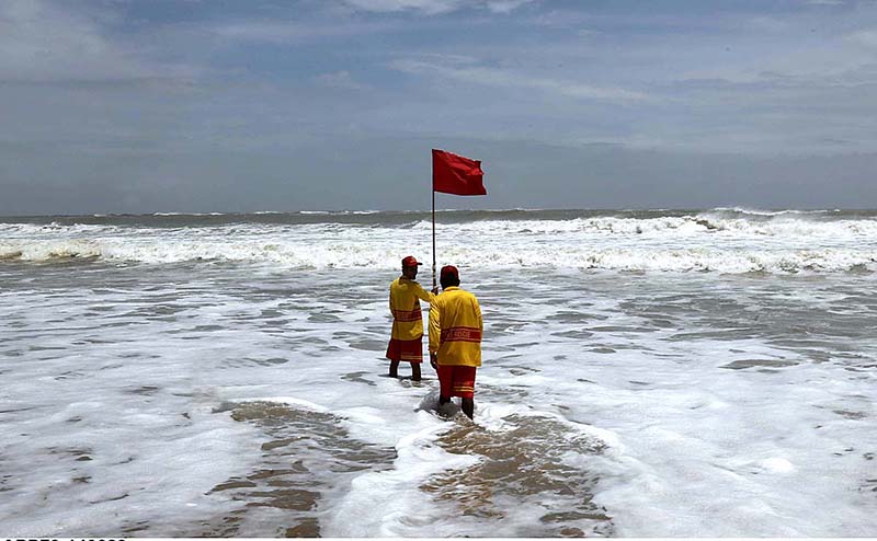 Officials placing red flag after alerts issued by the authorities regarding the effects of cyclone “Biparjoy” at the Hawksbay Beach